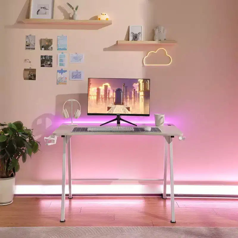 Bureau Gaming avec Lumières LED et Support Casque – 112 cm P x 70 cm L x 75 cm H, Cadre en Acier, Supporte 59 kg