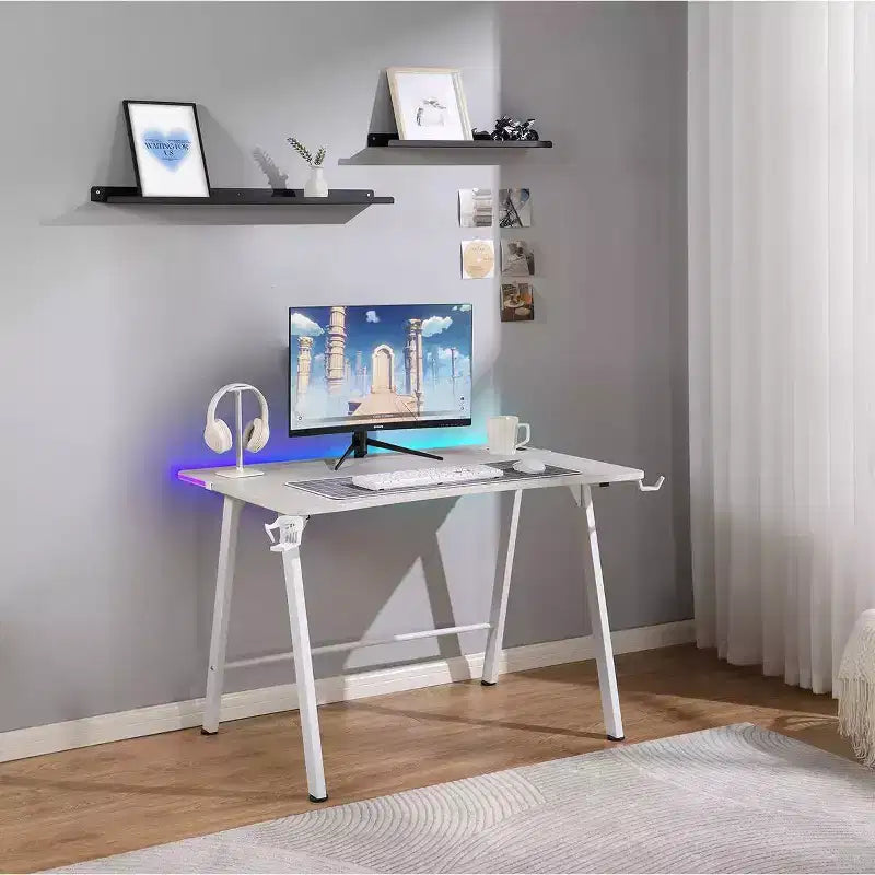 Bureau Gaming avec Lumières LED et Support Casque – 112 cm P x 70 cm L x 75 cm H, Cadre en Acier, Supporte 59 kg